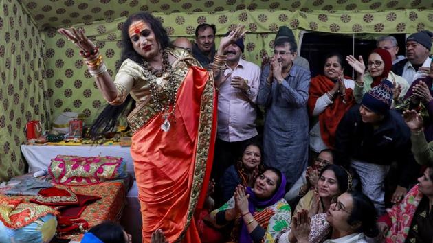 Lakshmi Narayan Tripathi, chief of the Kinnar Akhara for transgender people, sings among followers. The Kinnar Akhada on Sunday formally joined the Juna Akhada to participate in the Shahi Snan. “For us, this participation is about mainstream society accepting us. This is Akhada beyond sexuality. The creator is within us and once we perish we will go back to him. Our doors are open for all.” Tripathi told ANI. (Danish Siddiqui / REUTERS) Lakshmi Narayan Tripathi, chief of the Kinnar Akhara for transgender people, sings among followers. The Kinnar Akhada on Sunday formally joined the Juna Akhada to participate in the Shahi Snan. “For us, this participation is about mainstream society accepting us. This is Akhada beyond sexuality. The creator is within us and once we perish we will go back to him. Our doors are open for all.” Tripathi told ANI. (Danish Siddiqui / REUTERS)