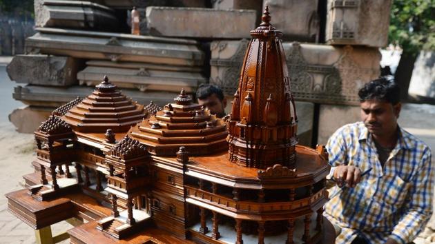 A worker polishes a model of a proposed Hindu temple at Ram Janmabhoomi Nyas workshop. Temple devotees want a grandiose structure built on the ruins of a medieval mosque that was razed by Hindu zealots in 1992 -- sparking religious riots that left 2,000 dead across India. A quarter century later the temple’s champions want to lay a foundation stone and see an opportunity in the 2019 election. (Sanjay Kanojia / AFP) A worker polishes a model of a proposed Hindu temple at Ram Janmabhoomi Nyas workshop. Temple devotees want a grandiose structure built on the ruins of a medieval mosque that was razed by Hindu zealots in 1992 -- sparking religious riots that left 2,000 dead across India. A quarter century later the temple’s champions want to lay a foundation stone and see an opportunity in the 2019 election. (Sanjay Kanojia / AFP)