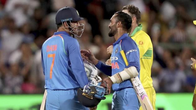 MS Dhoni (7) and Dinesh Karthik celebrate India’s win over Australia.(AP)