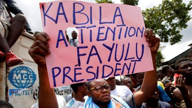 Supporters of the runner-up in Democratic Republic of Congo's presidential election, Martin Fayulu hold a sign before a political rally in Kinshasa, Democratic Republic of Congo on January 11.(REUTERS File) Supporters of the runner-up in Democratic Republic of Congo's presidential election, Martin Fayulu hold a sign before a political rally in Kinshasa, Democratic Republic of Congo on January 11.(REUTERS File)