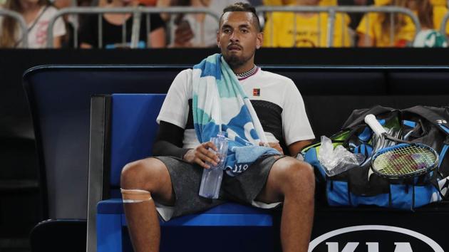 Nick Kyrgios takes a break during his Australian Open first round match against Canada’s Milos Raonic.(REUTERS)