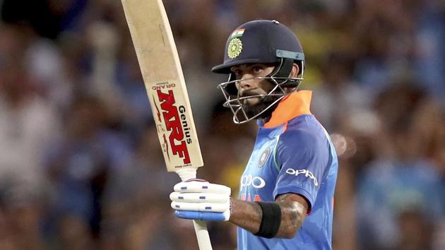 India's Virat Kohli celebrates his 100 against Australia during their one day international cricket match in Adelaide. (AP)