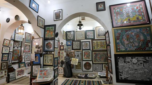 Hassan el-Shark holds his piece of art at his gallery in Minya Governorate. Mohamed el-Gebaly, director of Cairo’s Kortoba Art Gallery, said el-Shark is generally regarded as one of the most important artists in Egypt. “He not only expresses the beauty of Egypt and the East, but he also represents a condition that we miss,” he said. (Mohamed Abd El Ghany / REUTERS)