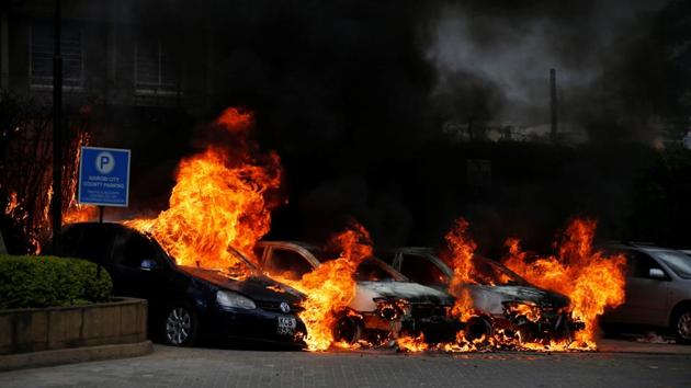 Cars are seen on fire at the scene where explosions and gunshots were heard at the Dusit hotel compound, in Nairobi, Kenya.(REUTERS)