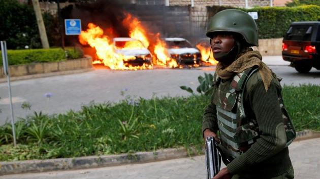 A policeman runs past burning cars at the scene where explosions and gunshots were heard at the Dusit hotel compound, in Nairobi, Kenya January 15, 2019. REUTERS/Baz Ratner (REUTERS) A policeman runs past burning cars at the scene where explosions and gunshots were heard at the Dusit hotel compound, in Nairobi, Kenya January 15, 2019. REUTERS/Baz Ratner (REUTERS)