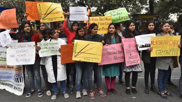 Research scholars from across the country staged a protest outside Shastri Bhawan in central Delhi on Wednesday in support of their long-standing demand of increasing the scholarship amount. A group of scholars had met Union HRD Minister Prakash Javadekar earlier this month following which the minister had said that the “government is positive about the demand”. However, no announcement in this regard has been made yet. (Burhaan Kinu / HT Photo) Research scholars from across the country staged a protest outside Shastri Bhawan in central Delhi on Wednesday in support of their long-standing demand of increasing the scholarship amount. A group of scholars had met Union HRD Minister Prakash Javadekar earlier this month following which the minister had said that the “government is positive about the demand”. However, no announcement in this regard has been made yet. (Burhaan Kinu / HT Photo)