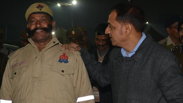 ADG PAC Binod Kumar Singh sharing a light moment with a PAC personnel sporting a big, twirly moustache during his recent visit to Kumbh Mela in Prayagraj(Sourced)