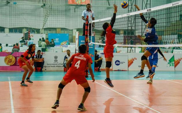 Maharashtra players (red) in action against Gujarat in the U-17 volleyball women match at Khelo India Youth Games 2019 held at Shiv Chhatrapati sports complex, Balewadi on Tuesday. (SANKET WANKHADE/HT PHOTO) 