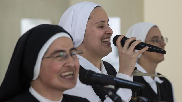 And now, the Peru-based sisters will play at the World Youth Day celebrations, a gathering of global Catholic youth in Panama presided over by Pope Francis. The message at the heart of their music? “We want to reach as many people as possible, and if the pope is included in that, we’re more than satisfied,” said Ivonne, who pens much of the lyrics. (Cris Bouroncle / AFP) And now, the Peru-based sisters will play at the World Youth Day celebrations, a gathering of global Catholic youth in Panama presided over by Pope Francis. The message at the heart of their music? “We want to reach as many people as possible, and if the pope is included in that, we’re more than satisfied,” said Ivonne, who pens much of the lyrics. (Cris Bouroncle / AFP)