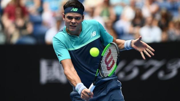 Canada's Milos Raonic hits a return against Switzerland's Stanislas Wawrinka.(AFP)