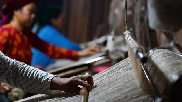 “I have almost no friends at school because they tease me for having no mother. I envy those kids with a mum,” the slight teenager told. “I have fun working here because I can earn some money and no-one teases me,” Van said. She’s been taken in by the older women she works with at the co-op, where she has earned a reputation as a skilled embroiderer. (Nhac Nguyen / AFP) “I have almost no friends at school because they tease me for having no mother. I envy those kids with a mum,” the slight teenager told. “I have fun working here because I can earn some money and no-one teases me,” Van said. She’s been taken in by the older women she works with at the co-op, where she has earned a reputation as a skilled embroiderer. (Nhac Nguyen / AFP)