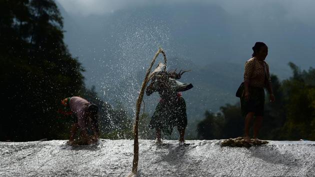 Hmong women wash clothes in a stream. With the jobs she is providing, Mai hopes for empowerment in a culture where sexism runs deep and where most women earn just a few dollars a month as farmers. That poverty is in part what drives the cross-border trade in women and boosting incomes protects potential victims -- and increases their social status. (Nhac Nguyen / AFP) Hmong women wash clothes in a stream. With the jobs she is providing, Mai hopes for empowerment in a culture where sexism runs deep and where most women earn just a few dollars a month as farmers. That poverty is in part what drives the cross-border trade in women and boosting incomes protects potential victims -- and increases their social status. (Nhac Nguyen / AFP)