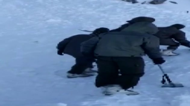 Ten people were trapped under snow after an avalanche in Ladakh’s Khardung La pass on Friday morning.(ANI Photo)