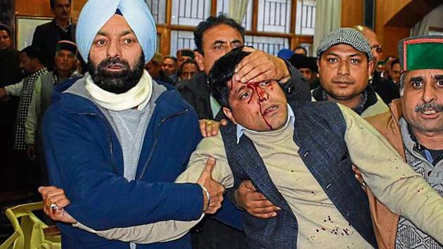 Workers taking a person injured during a scuffle between two factions of Congress at an event of the party n Shimla on Thursday, January 17, 2019. (HT Photo) Workers taking a person injured during a scuffle between two factions of Congress at an event of the party n Shimla on Thursday, January 17, 2019. (HT Photo)