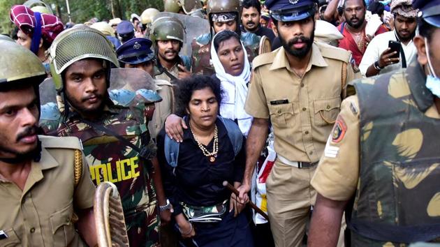 Bindu Ammini and Kanakadurga are escorted by police after they attempted to enter the Sabarimala temple in Pathanamthitta district in the southern state of Kerala in December. They succeeded in enetring the shrine in Januray 2019.(REUTERS)