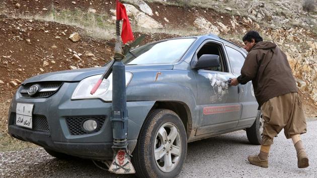 Hoshyar Ali opens the door of his car which has a minefield warning sign mounted on the front, images of mines across its sides and an ominous warning to any explosives he hasn’t yet removed: ‘I’m ready to eradicate you where ever(sic) you are’. (Ako Rasheed / REUTERS) Hoshyar Ali opens the door of his car which has a minefield warning sign mounted on the front, images of mines across its sides and an ominous warning to any explosives he hasn’t yet removed: ‘I’m ready to eradicate you where ever(sic) you are’. (Ako Rasheed / REUTERS)