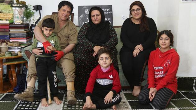 Hoshyar Ali with his family at his home. As part of his mission to rid the area of mines Ali also visits local schools, taking workshops for students about safety and preparedness against explosives. He has also visited Vietnam to share his expertise. (Ako Rasheed / REUTERS) Hoshyar Ali with his family at his home. As part of his mission to rid the area of mines Ali also visits local schools, taking workshops for students about safety and preparedness against explosives. He has also visited Vietnam to share his expertise. (Ako Rasheed / REUTERS)