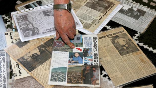 Ali refers to newspapers that have published his story about the loss of his limbs, at his home. He also lost his parents and sisters to chemical attacks during the Anfal Genocide during the Saddam regime and later lost a son, aged 15, to a car accident. (Ako Rasheed / REUTERS) Ali refers to newspapers that have published his story about the loss of his limbs, at his home. He also lost his parents and sisters to chemical attacks during the Anfal Genocide during the Saddam regime and later lost a son, aged 15, to a car accident. (Ako Rasheed / REUTERS)