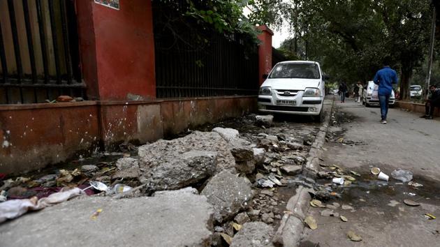 This is what remains of a footpath near Lok Nayak Hospital.(Amal KS / HT Photo)
