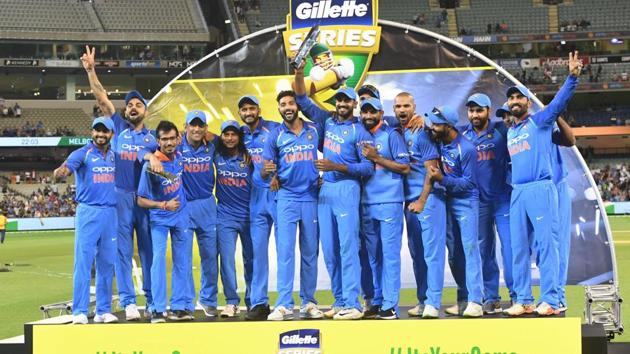 Indian cricket players pose with the trophy. (AP)