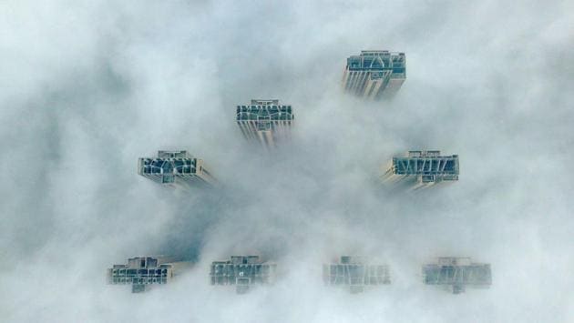 An aerial view shows the tops of highrise buildings poking out from heavy fog in Yangzhou, in China’s eastern Jiangsu province. (Stringer / AFP) An aerial view shows the tops of highrise buildings poking out from heavy fog in Yangzhou, in China’s eastern Jiangsu province. (Stringer / AFP)