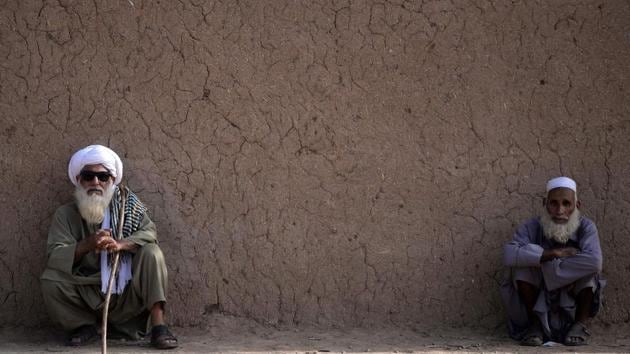 Elder Afghan refugees sit outside their mud house at a refugee camp on the outskirts of Islamabad. Pakistan is one of the largest refugee-hosting nations in the world, but many Pakistanis have long viewed Afghan refugees in particular suspiciously. (Aamir Qureshi / AFP) Elder Afghan refugees sit outside their mud house at a refugee camp on the outskirts of Islamabad. Pakistan is one of the largest refugee-hosting nations in the world, but many Pakistanis have long viewed Afghan refugees in particular suspiciously. (Aamir Qureshi / AFP)