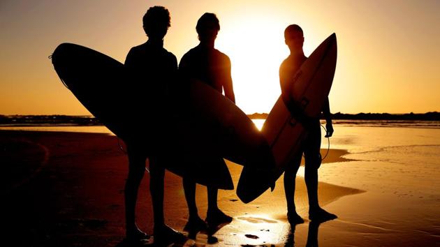 Portuguese surfers stand on the beach with their surfboards at sunset during the men’s qualifying series of the World Surf League SEAT Pro Netanya, in the Israeli coastal city of Netanya. (Jack Guez / AFP) Portuguese surfers stand on the beach with their surfboards at sunset during the men’s qualifying series of the World Surf League SEAT Pro Netanya, in the Israeli coastal city of Netanya. (Jack Guez / AFP)