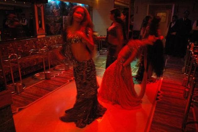 Bar girls entertain customers in a dance bar at Andheri West.(HT Photo)