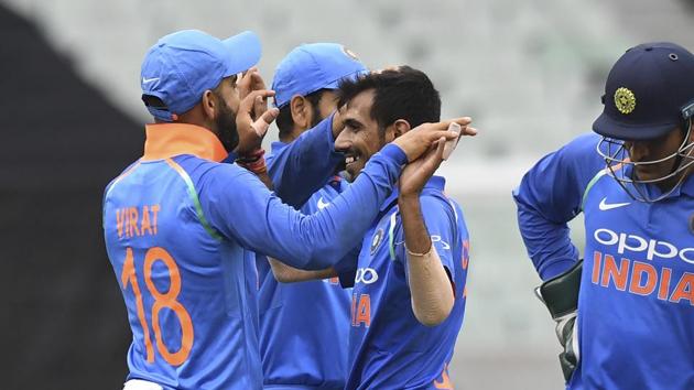 India's Yuzvendra Chahal and India's Virat Kohli, left, react during their one day international cricket match against Australia in Melbourne, Australia, Friday, Jan. 18, 2019.(AP)