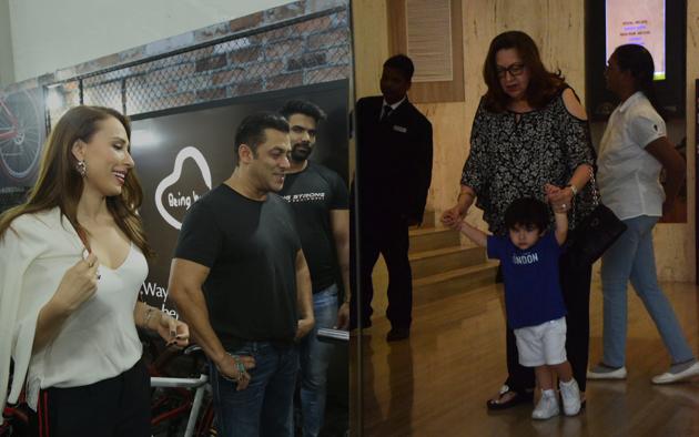 Salman Khan takes on fitness challenge and Taimur at a party.(Viral Bhayani)