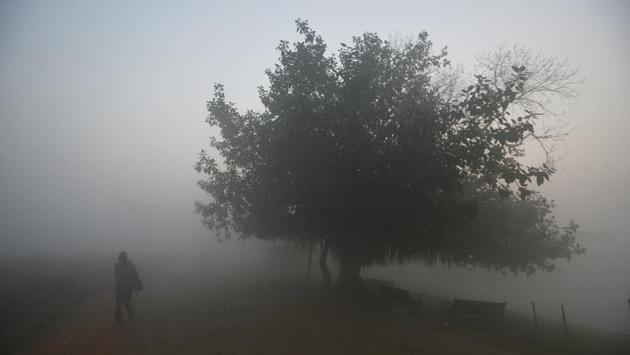 A man walks across an open field enveloped in dense fog on a cold winter morning, near Akshardham, in New Delhi. (Biplov Bhuyan / HT Photo) A man walks across an open field enveloped in dense fog on a cold winter morning, near Akshardham, in New Delhi. (Biplov Bhuyan / HT Photo)