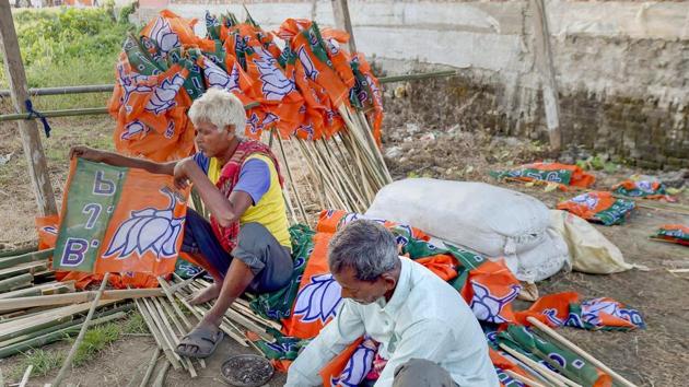 Workers readying BJP flags ahead of BJP National President Amit Shah's proposed rally to launch 'Save Democracy Rath Yatra', in West Bengal in December 2018. After the programme was cancelled as the Bengal government refused permission, the BJP plans to hold public meetings in all of the state’s Lok Sabha constituencies by Feb 8 (File Photo) (PTI) Workers readying BJP flags ahead of BJP National President Amit Shah's proposed rally to launch 'Save Democracy Rath Yatra', in West Bengal in December 2018. After the programme was cancelled as the Bengal government refused permission, the BJP plans to hold public meetings in all of the state’s Lok Sabha constituencies by Feb 8 (File Photo) (PTI)
