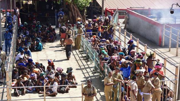 Devotees wait in line to visit the Sabarimala temple in Kerala following the entry of two women on January 2, 2019.(AFP File Photo)