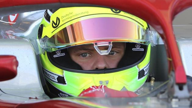 Mick Schumacher prepares for the test drive in his new formula 2 Prema racing car at the Yas Marina Circuit in Abu Dhabi.(AP)