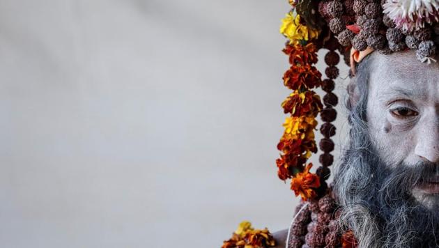 A Naga Sadhu waits for devotees inside his camp during the 2019 Kumbh Mela or the Pitcher Festival, in Prayagraj, previously known as Allahabad, in Uttar Pradesh. (Danish Siddiqui / REUTERS) A Naga Sadhu waits for devotees inside his camp during the 2019 Kumbh Mela or the Pitcher Festival, in Prayagraj, previously known as Allahabad, in Uttar Pradesh. (Danish Siddiqui / REUTERS)