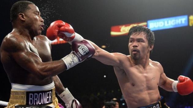 Manny Pacquiao (right) and Adrien Broner during their WBA welterweight world title boxing bout.(Reuters)