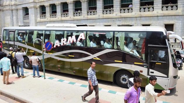 The file photo shows Congress MLAs, sitting in a bus, leaving the Vidhana Soudha after staging a protest dharna against the swearing-in of B S Yeddyurappa as Karnataka chief minister, in Bengaluru .(PTI/ Representative Image)