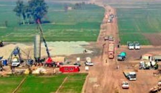 Construction work going on in full swing on Pakistan side of Kartarpur Sahib corridor, in Narowal district of west Punjab. In the backdrop is the gurdwara.(HT Photo)