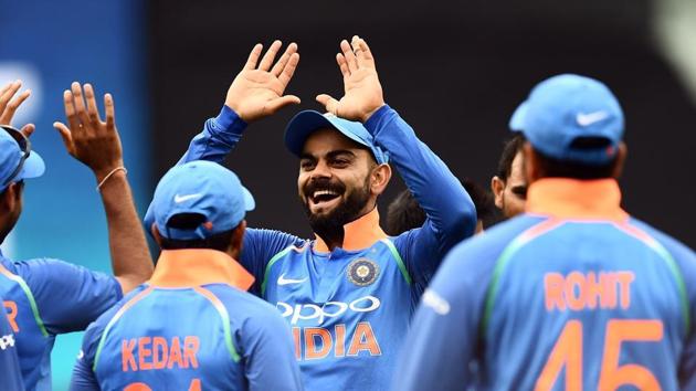 In this file photo taken on January 18, 2019 India's Virat Kohli (C) celebrates with teammates after the dismissal o f Australia's Glenn Maxwell (not in picture) during the third one-day international cricket match between Australia and India at the Melbourne Cricket Ground in Melbourne.(AFP)