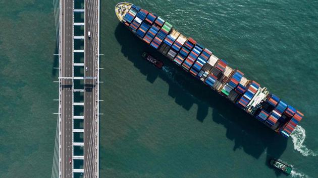 A giant container ship sailing beneath a bridge in Hong Kong. “I wanted to do a package showing the density, uniformity and contrast of the city to give a sense of living in Hong Kong,” de la Rey explained. (Dale de la Rey / AFP) A giant container ship sailing beneath a bridge in Hong Kong. “I wanted to do a package showing the density, uniformity and contrast of the city to give a sense of living in Hong Kong,” de la Rey explained. (Dale de la Rey / AFP)