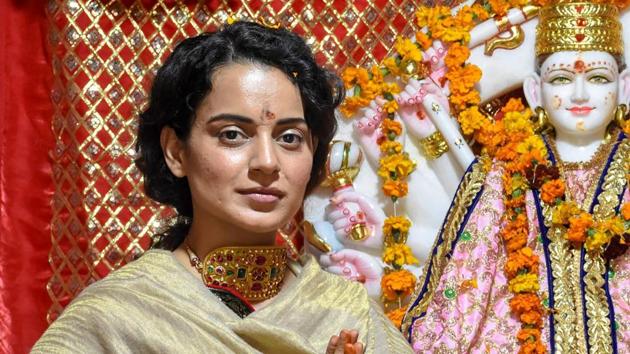 Bollywood actor Kangana Ranaut poses for photos as she pays obeisance at a newly-built temple, in Mandi.(PTI)