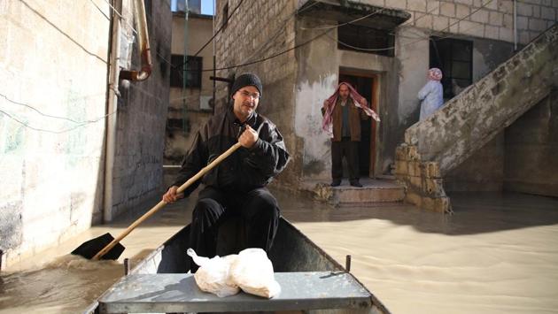 “In winter, I don’t usually leave the house much as it is cold and it rains. But this year I felt that people needed me,” he said as he provided yet another ferry ride to grateful fellow townspeople. Abu Ihab normally uses his boat for summer fishing on the Orontes to supplement his farm produce. (Aaref Watad / AFP)