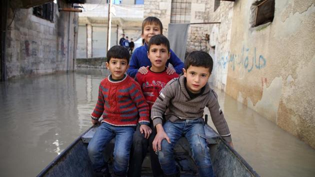 Across the province, the torrential rains have triggered flash floods that have caused widespread hardship, particularly in the vast tent cities set up for the displaced. (Aaref Watad / AFP)