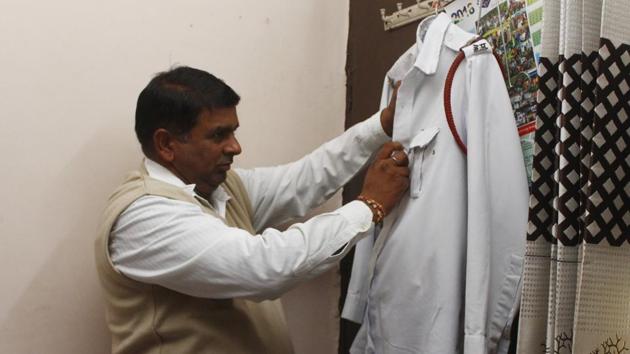 ASI Raj Kumar primps his uniform. Professor of Psychology at MD University (Rohtak) Shalini Singh, who has been taking counselling sessions with the police department said, “Working long hours with constant stress and in the absence of a weekly off, they get frustrated and become very prone to mental illnesses. Even a day’s rest is extremely beneficial for mental health. This is a timely and humanitarian decision.” (Yogendra Kumar / HT Photo)