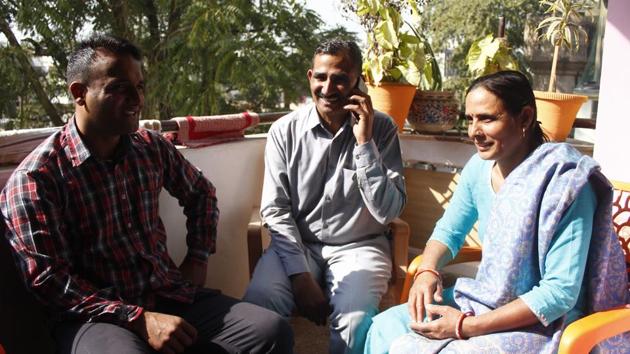 Head constable Surinder Singh (C) basks in the sun with his family. “This is my first weekly off in 16 years of service. I feel happy, almost like the time when I got married,” said the 49-year-old. Posted at Traffic Tower in Sushant Lok 1, he was among the 850 police personnel who got the first weekly off of their careers in the police force on Sunday. (Yogendra Kumar / HT Photo)