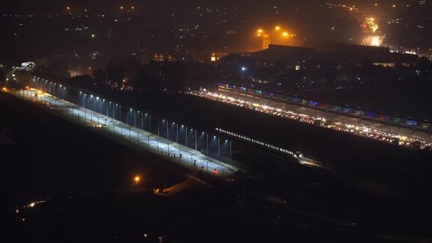 An aerial view of newly built bridge across Yamuna river in Noida. The six-lane bridge is set to be opened for public on January 25.(Virendra Singh Gosain/HT Photo)