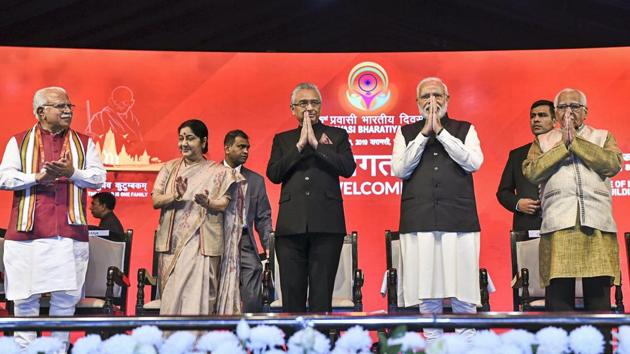 Prime Minister Narendra Modi, External Affairs Minister Sushma Swaraj, Haryana Chief Minister Manohar Lal Khattar, Uttar Pradesh Governor Ram Naik and others during the inauguration of the Pravasi Bhartiya Divas (PBD) Convention 2019, in Varanasi. The theme of the ongoing Pravasi Bharatiya Divas is ‘Role of Indian diaspora in building new India’. (PTI) Prime Minister Narendra Modi, External Affairs Minister Sushma Swaraj, Haryana Chief Minister Manohar Lal Khattar, Uttar Pradesh Governor Ram Naik and others during the inauguration of the Pravasi Bhartiya Divas (PBD) Convention 2019, in Varanasi. The theme of the ongoing Pravasi Bharatiya Divas is ‘Role of Indian diaspora in building new India’. (PTI)