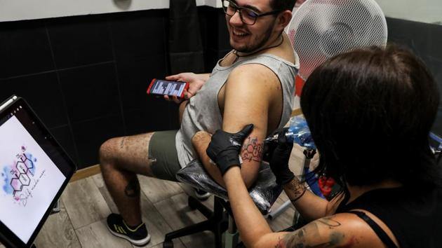 Gabriel, 20, gets a tattoo of a testosterone molecule and the words 'Self-Made Man' at a tattoo parlour on September 18, 2018. The World Health Organisation ruled in June that being transgender should no longer be classified as a mental disorder. It now considers it “gender incongruence” under sexual health conditions. (Susana Vera / REUTERS) Gabriel, 20, gets a tattoo of a testosterone molecule and the words 'Self-Made Man' at a tattoo parlour on September 18, 2018. The World Health Organisation ruled in June that being transgender should no longer be classified as a mental disorder. It now considers it “gender incongruence” under sexual health conditions. (Susana Vera / REUTERS)