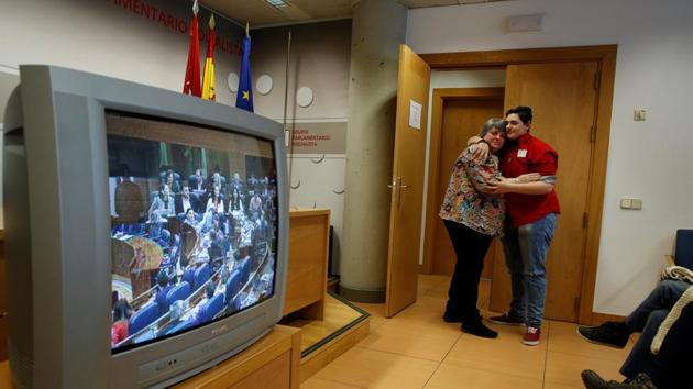 Gabriel hugs his mother Mariely as the Madrid regional Parliament approves a law to make the transition easier for trans minors on March 17, 2016. "My mother has had a hard time with my transition, but she's behind me a hundred percent. Things would have been so much harder if I didn't have my parents' support," Diaz de Tudanca said. (Susana Vera / REUTERS) Gabriel hugs his mother Mariely as the Madrid regional Parliament approves a law to make the transition easier for trans minors on March 17, 2016. "My mother has had a hard time with my transition, but she's behind me a hundred percent. Things would have been so much harder if I didn't have my parents' support," Diaz de Tudanca said. (Susana Vera / REUTERS)