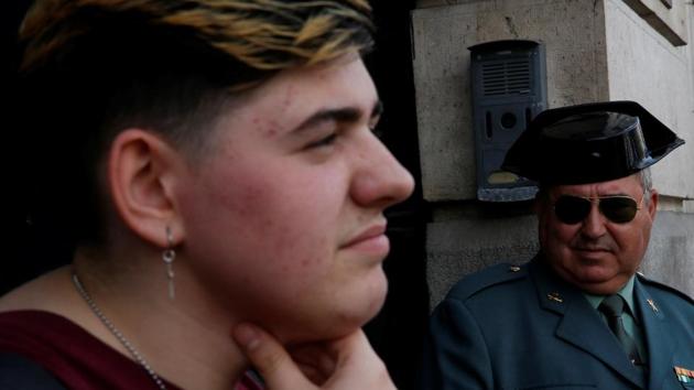 A Spanish Civil Guard looks at Gabriel Diaz de Tudanca after attending the official presentation of the public campaign to fight hate crimes in which he was featured, in Madrid on May 17, 2016. In terms of LGBT rights, Spain ranks relatively high in surveys. But authorities require a mental health diagnosis before allowing gender change on documents, as being transgender is classed a mental illness. (Susana Vera / REUTERS) A Spanish Civil Guard looks at Gabriel Diaz de Tudanca after attending the official presentation of the public campaign to fight hate crimes in which he was featured, in Madrid on May 17, 2016. In terms of LGBT rights, Spain ranks relatively high in surveys. But authorities require a mental health diagnosis before allowing gender change on documents, as being transgender is classed a mental illness. (Susana Vera / REUTERS)